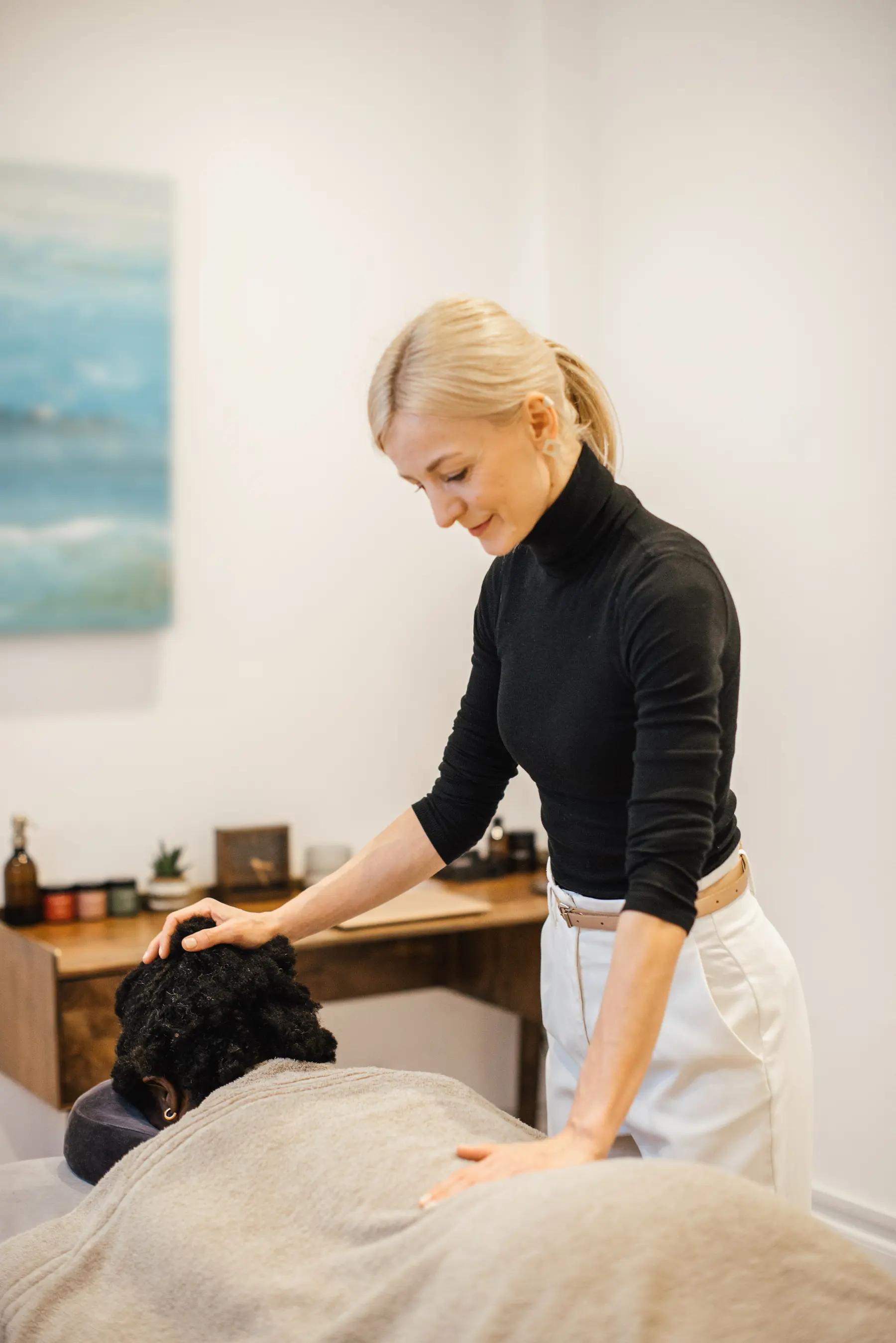 Therapist performing a relaxing holistic massage for overall well-being.