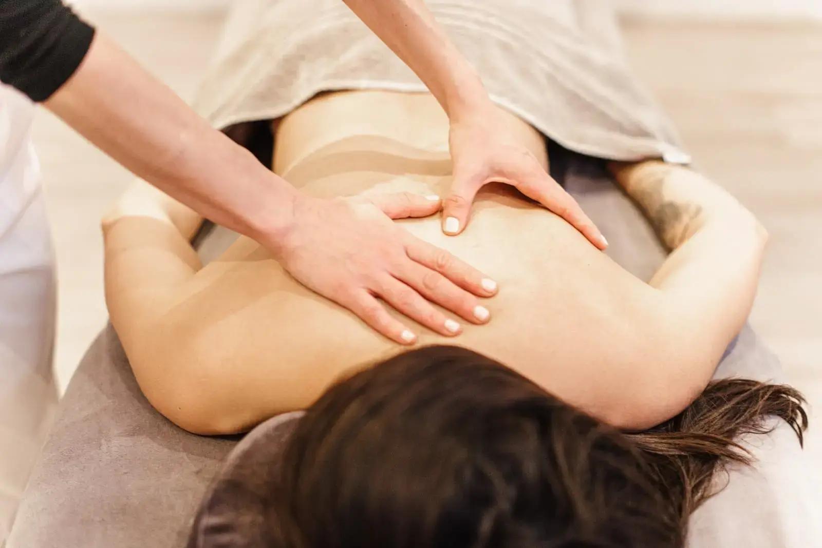 Marta giving a relaxing back massage to a client